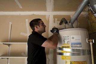 Peter is one of our Redmond water heater repair pros and he is fixing a broken unit 